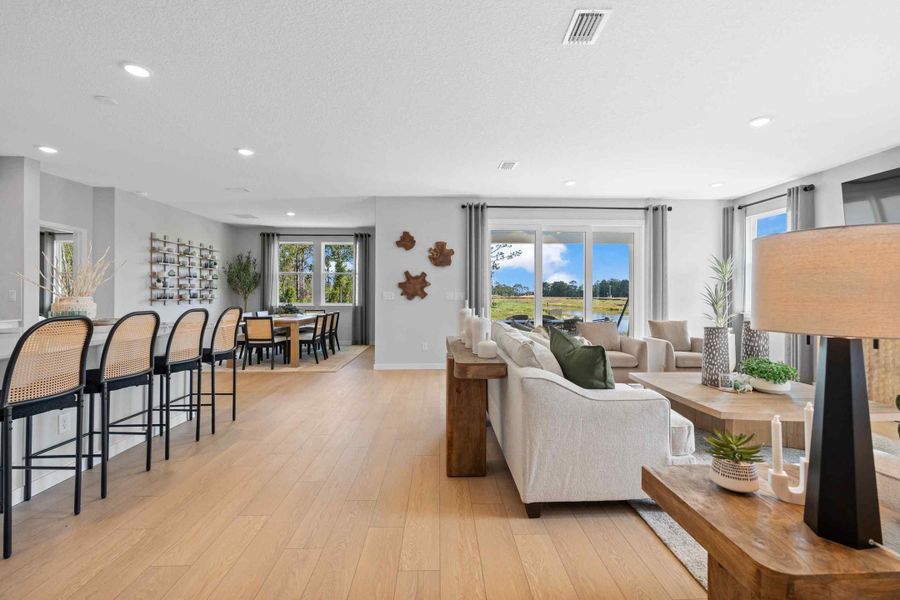 A living room with a wood floor. A living room with a wood floor.