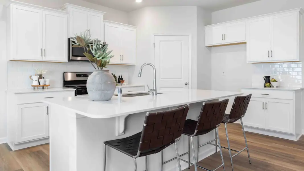 Furnished interior in a model home at Sweetwater Village in Rockwell (Image 7).