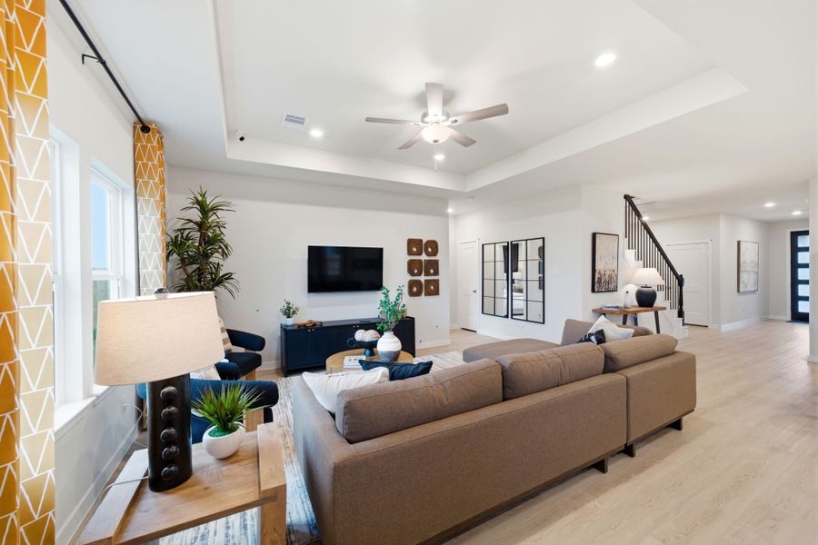 A living room with a couch and a tv. A living room with a couch and a tv.