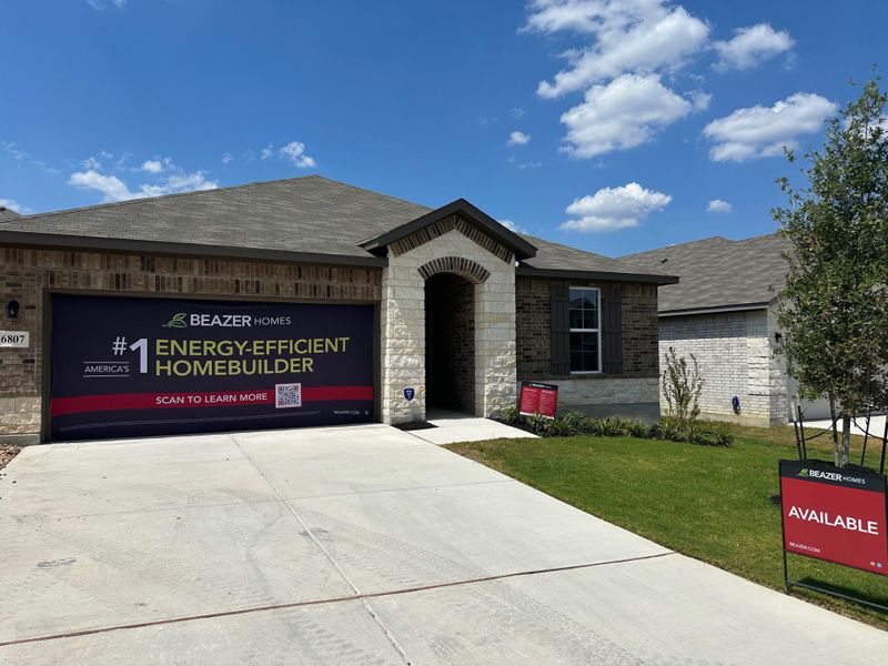 A charming brick home with a manicured lawn in Comanche Ridge by Beazer Homes (San Antonio, TX). A charming brick home with a manicured lawn in Comanche Ridge by Beazer Homes (San Antonio, TX).