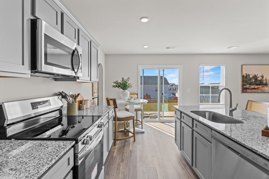 Furnished interior in a model home at Canary Woods in Hopkins (Image 11).