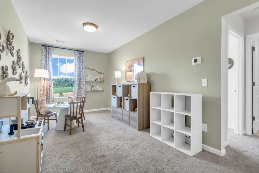 Furnished interior in a model home at Reeves Crossing in St. George (Image 17).
