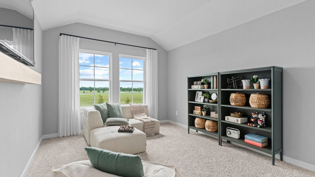 Furnished interior in a model home at Caldwell Crossing in Iowa Colony (Image 25).