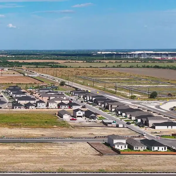 Aerial view of the Medina Crossing - Villa Collection community in Von Ormy, TX, showing layout and nearby surroundings (Image 1).