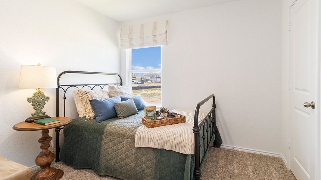 Furnished interior in a model home at Preserve at Medina in Von Ormy (Image 36).