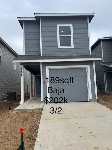 A modern gray two-story home with a garage in Aston Park: Wellton Collection by Lennar (San Antonio, TX).