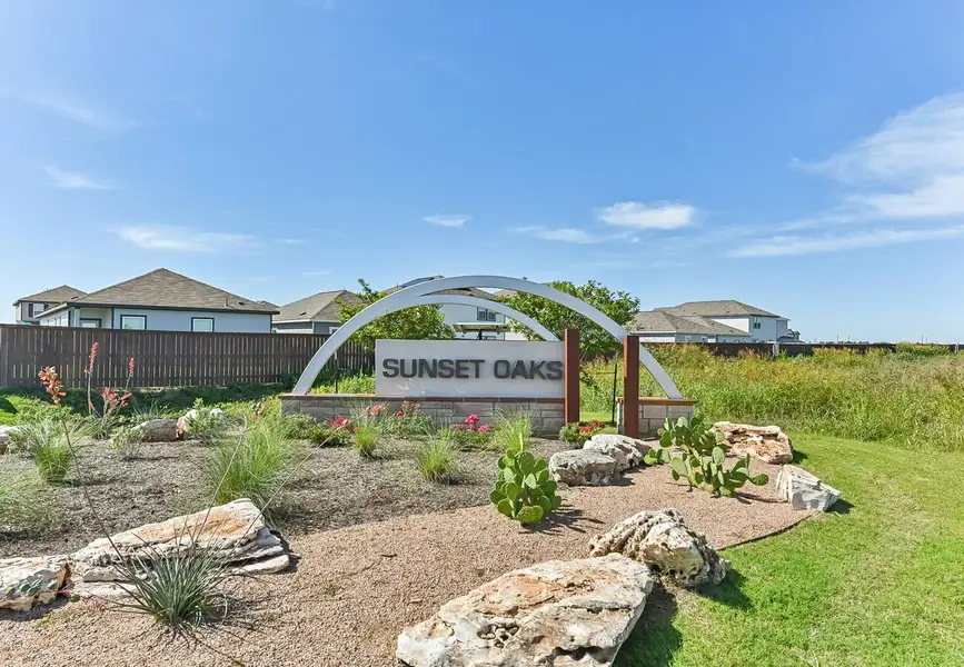 Entrance to the Sunset Oaks community in Maxwell, TX, featuring signage and landscaping (Image 1). Entrance to the Sunset Oaks community in Maxwell, TX, featuring signage and landscaping (Image 1).