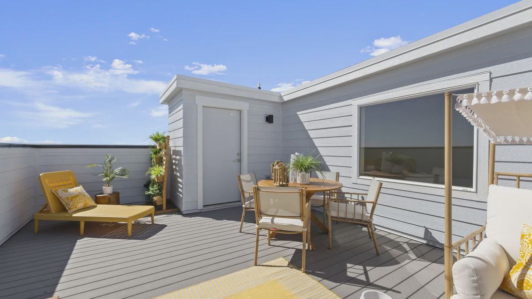 Experience luxury on the spacious rooftop deck featuring elegant wood textures in Dillon Pointe community. Experience luxury on the spacious rooftop deck featuring elegant wood textures in Dillon Pointe community.