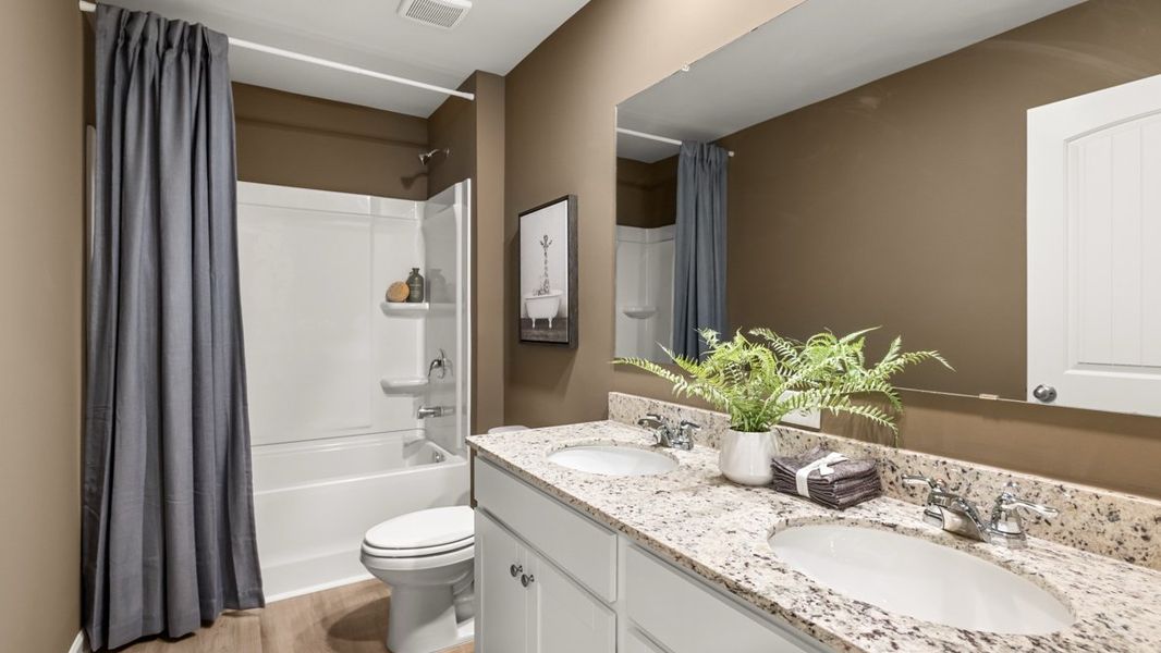 Furnished interior in a model home at Sheffield Highlands in Dallas (Image 50).