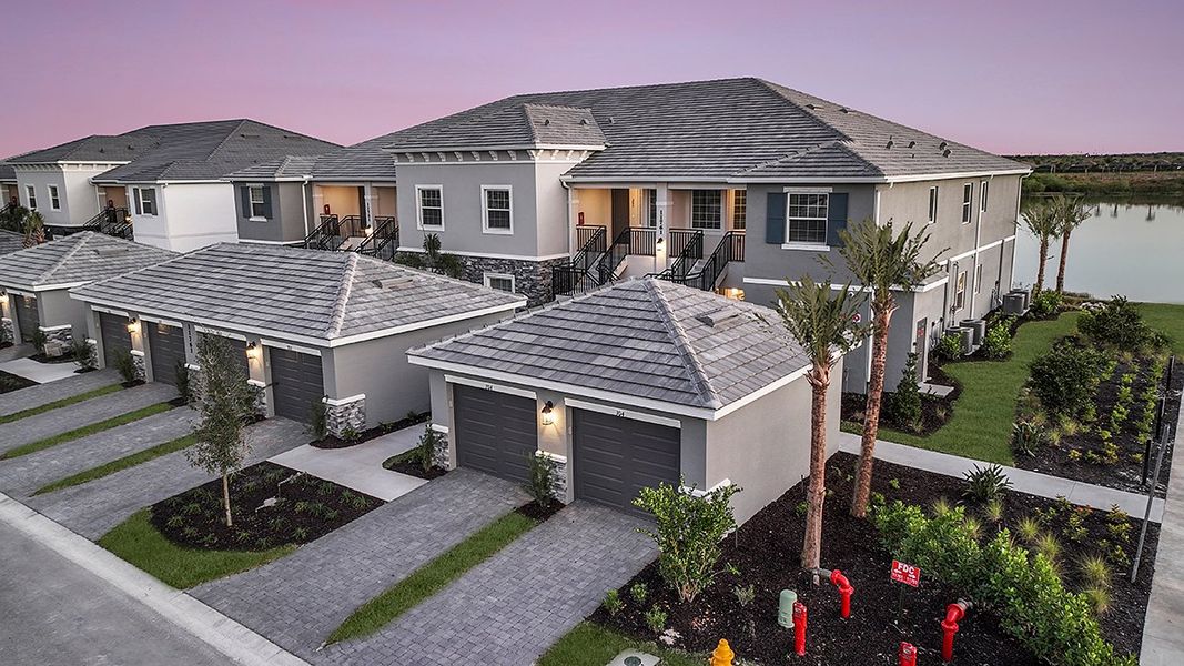 Front exterior of a home in the Esplanade Lake Club Condos community, located in Fort Myers, FL (Image 35).