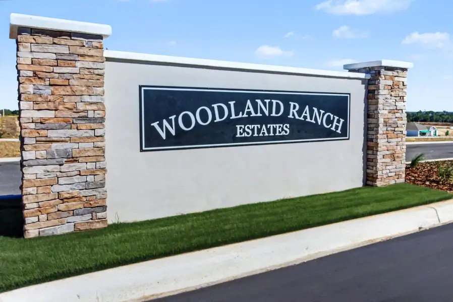 Entrance to the Woodland Ranch community in Lake Wales, FL, featuring signage and landscaping (Image 2).