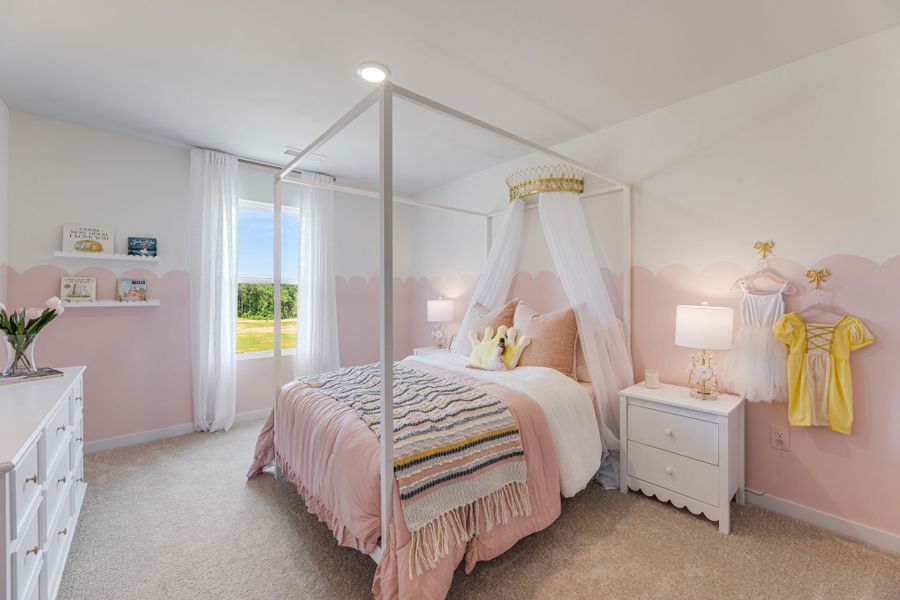 A bedroom with a bed and a window.