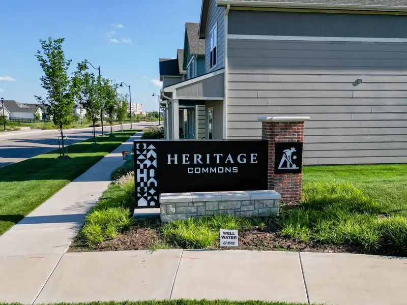 Entrance to the Heritage Commons community in Andover, KS, featuring signage and landscaping (Image 2). Entrance to the Heritage Commons community in Andover, KS, featuring signage and landscaping (Image 2).