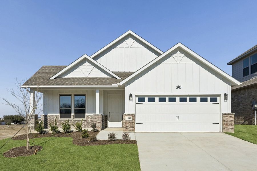 Front exterior of a home in the Tabor Ranch community, located in Ponder, TX (Image 11).