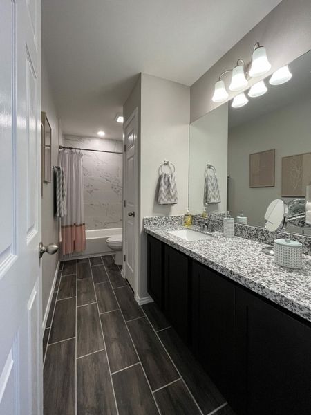 Furnished interior in a model home at Villas San Agustin in Laredo (Image 10).