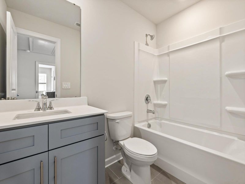 Furnished interior in a model home at Russell Grove - Rolling Hills Series in Charlotte (Image 19).