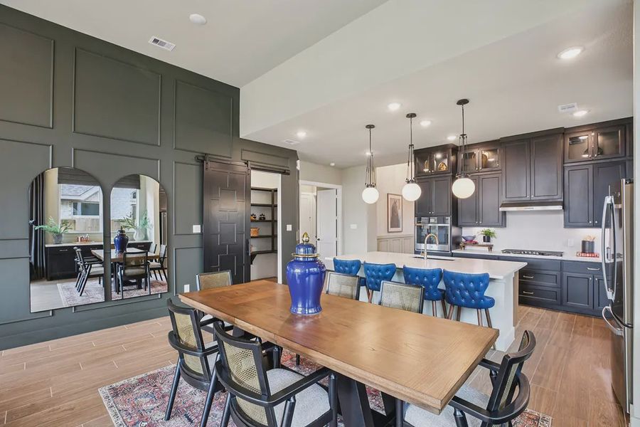 Furnished interior in a model home at Meridiana 50's in Manvel (Image 17).