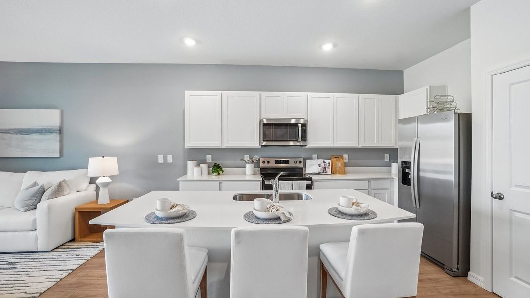 Furnished interior in a model home at Sanctuary at Citrus Park Townhomes in Tampa (Image 11).