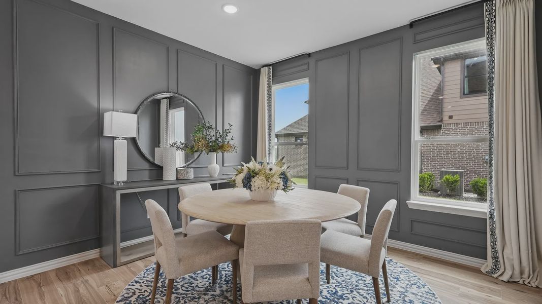 Experience luxury with sophisticated paneling and expansive windows in the Westridge dining room.