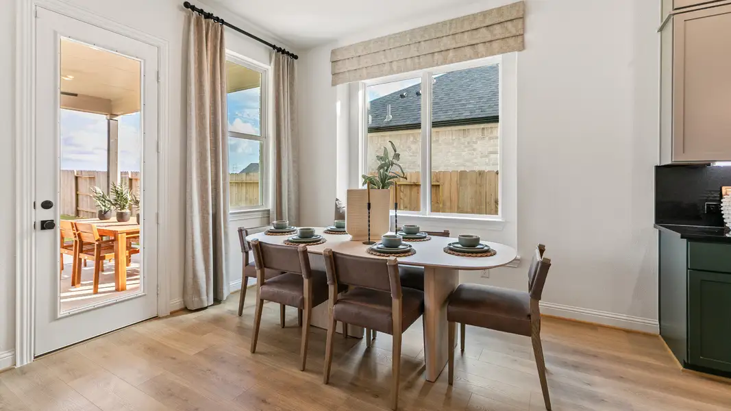 Furnished interior in a model home at Creekhaven in Iowa Colony (Image 7).