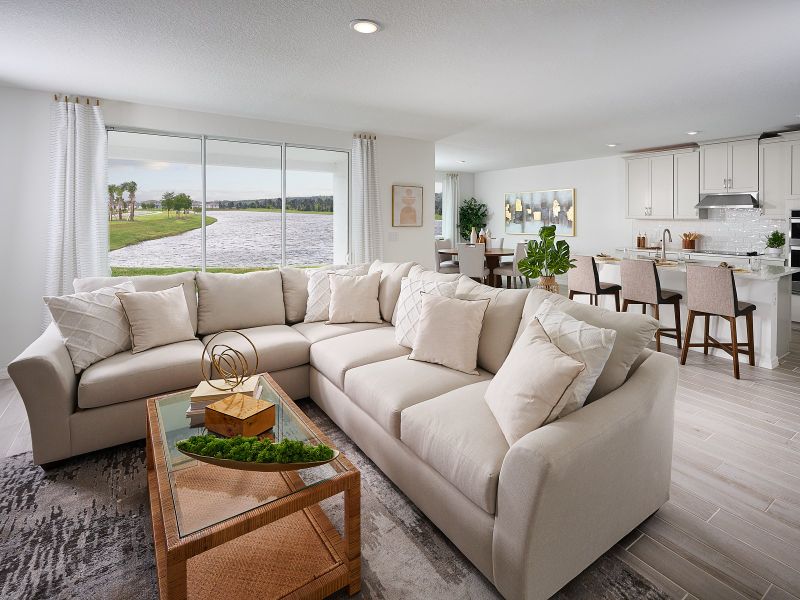 Great room of the Jasmine floorplan modeled at Salt Meadows.