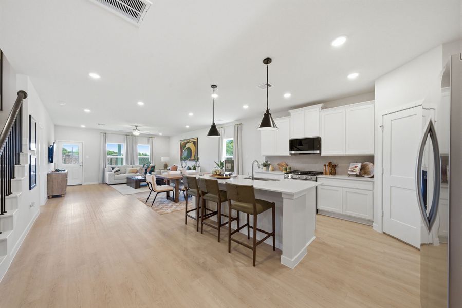 A kitchen with white cabinets. A kitchen with white cabinets.