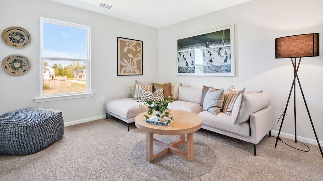 Furnished interior in a model home at Bella Point in Bolivia (Image 22).
