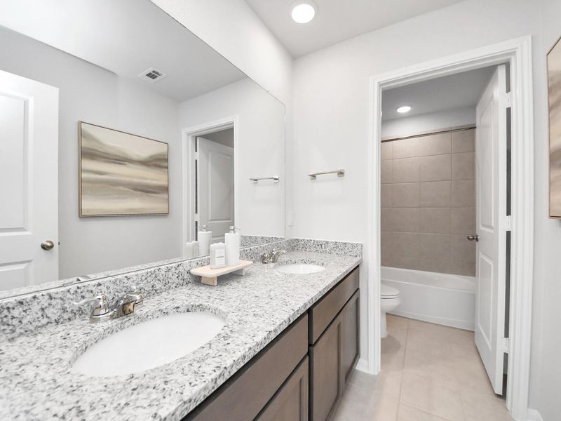 Furnished interior in a model home at Sunterra in Katy (Image 35).