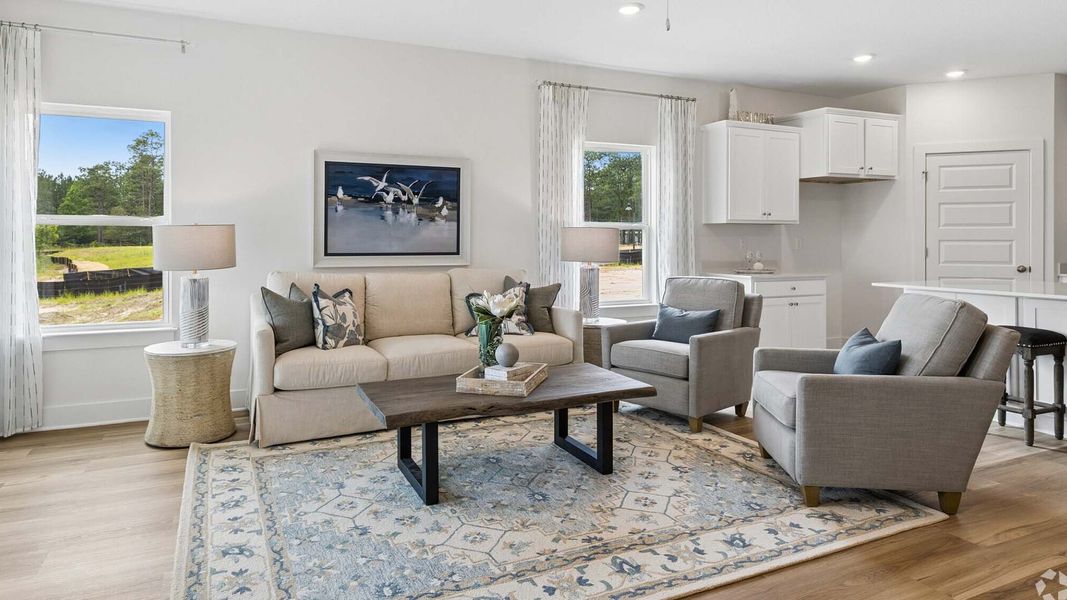 Furnished interior in a model home at Ashton Park Phase III in Freeport (Image 5).