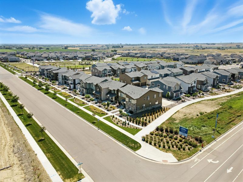 Aerial view of the Pintail Commons at Johnstown Village community in Johnstown, CO, showing layout and nearby surroundings (Image 11). Aerial view of the Pintail Commons at Johnstown Village community in Johnstown, CO, showing layout and nearby surroundings (Image 11).