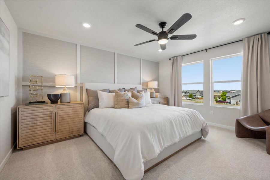 A bedroom with a large bed. A bedroom with a large bed.