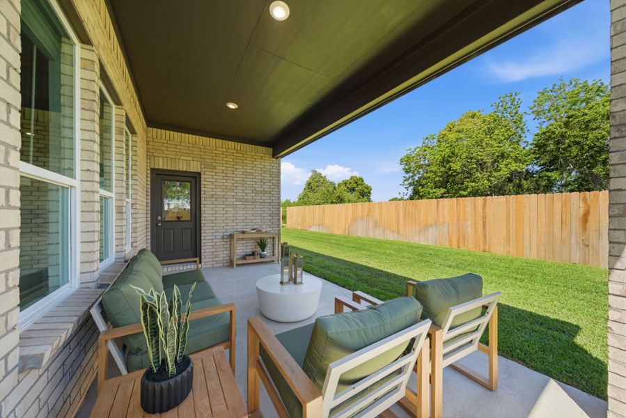 A patio with a table and chairs.