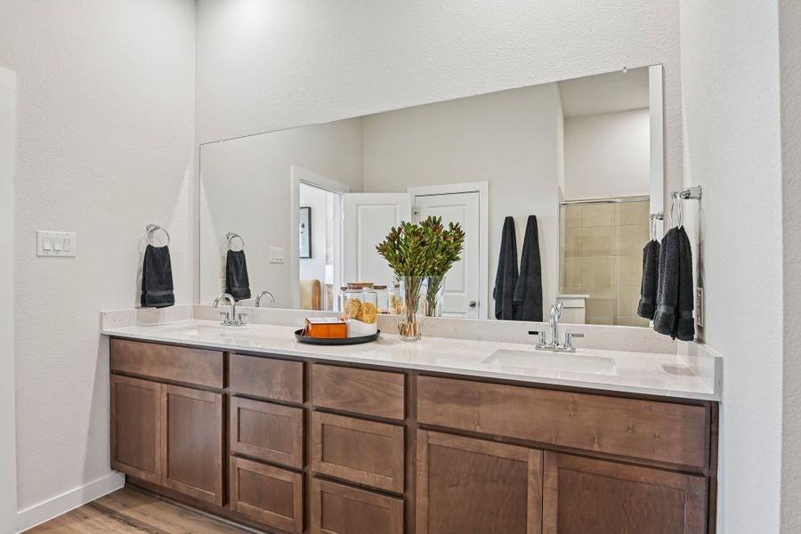 A bathroom with a large mirror.