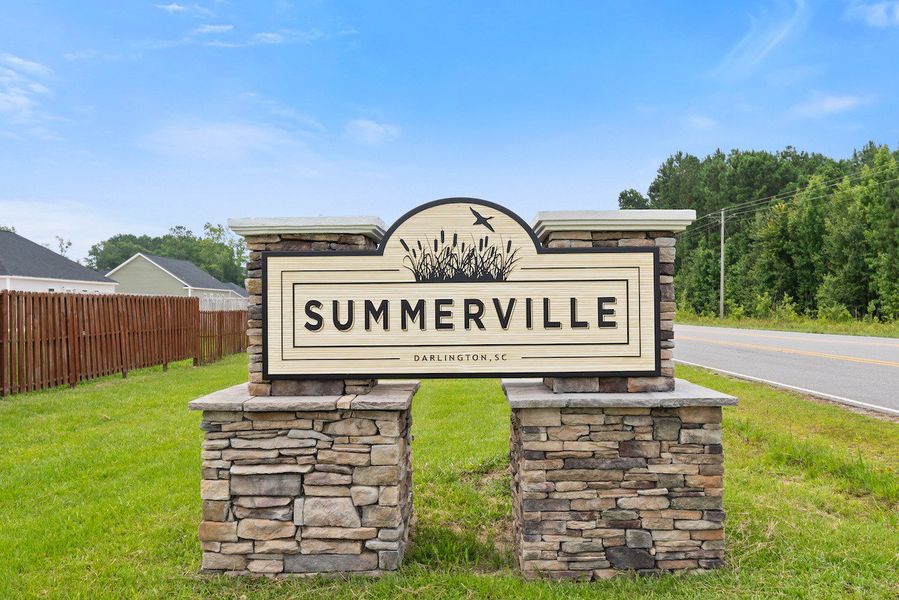 Entrance to the Summerville community in Darlington, SC, featuring signage and landscaping (Image 9). Entrance to the Summerville community in Darlington, SC, featuring signage and landscaping (Image 9).