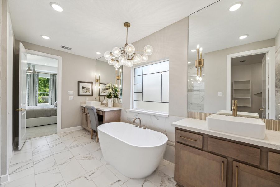 Furnished interior in a model home at The Woodlands Hills – 55' in Willis (Image 18).