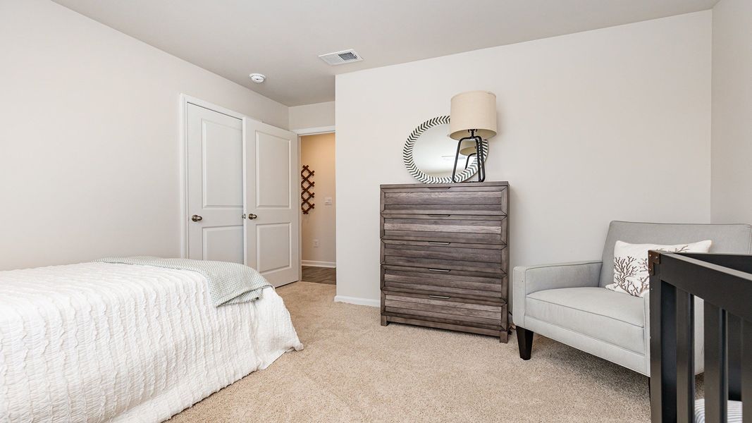Furnished interior in a model home at Silver Oaks in Ocean Isle Beach (Image 4).