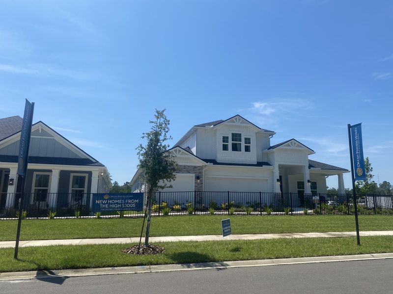 Charming white home with a fenced yard in Jennings Farm by Dream Finders Homes, Middleburg, FL.