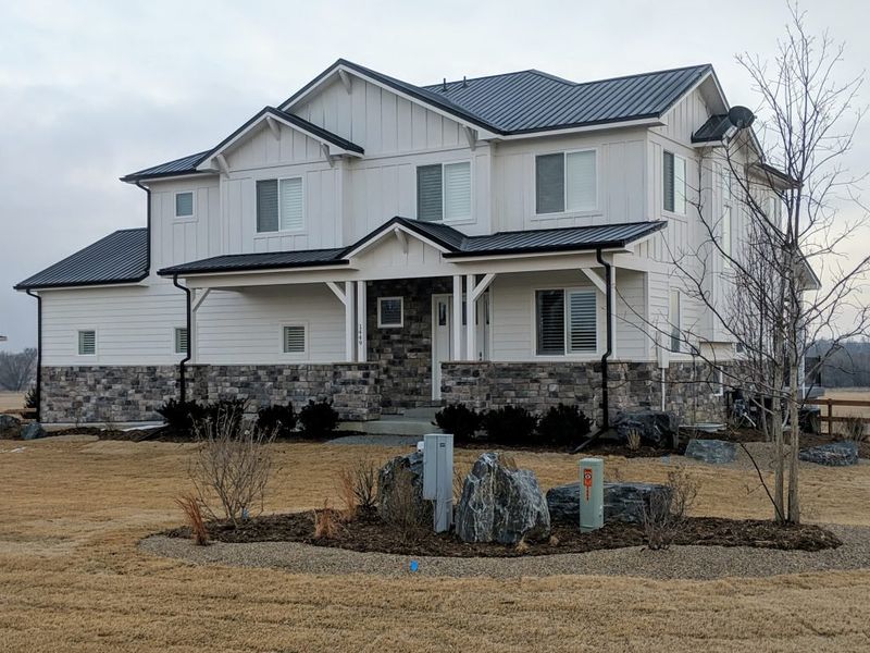 Front exterior of a home in the Red Barn community, located in Platteville, CO (Image 4).