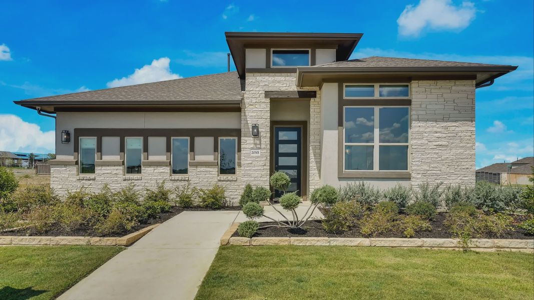 Elegant brick facade and expansive windows define this luxurious Carillon community residence. Elegant brick facade and expansive windows define this luxurious Carillon community residence.