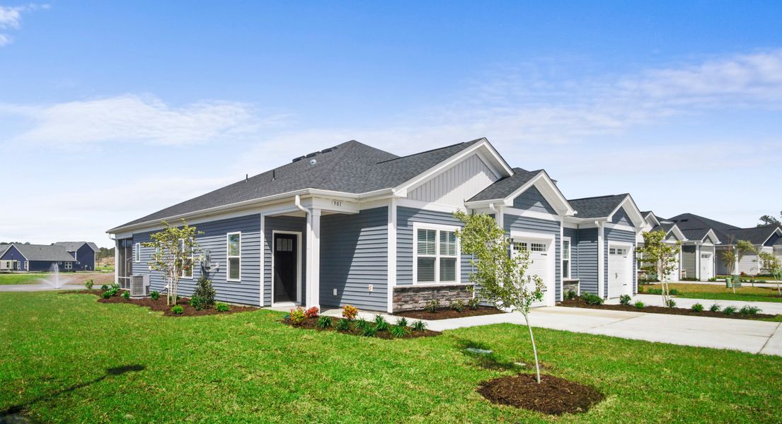 Front exterior of a home in the The Paired Villas at Bridgewater community, located in Little River, SC (Image 4).