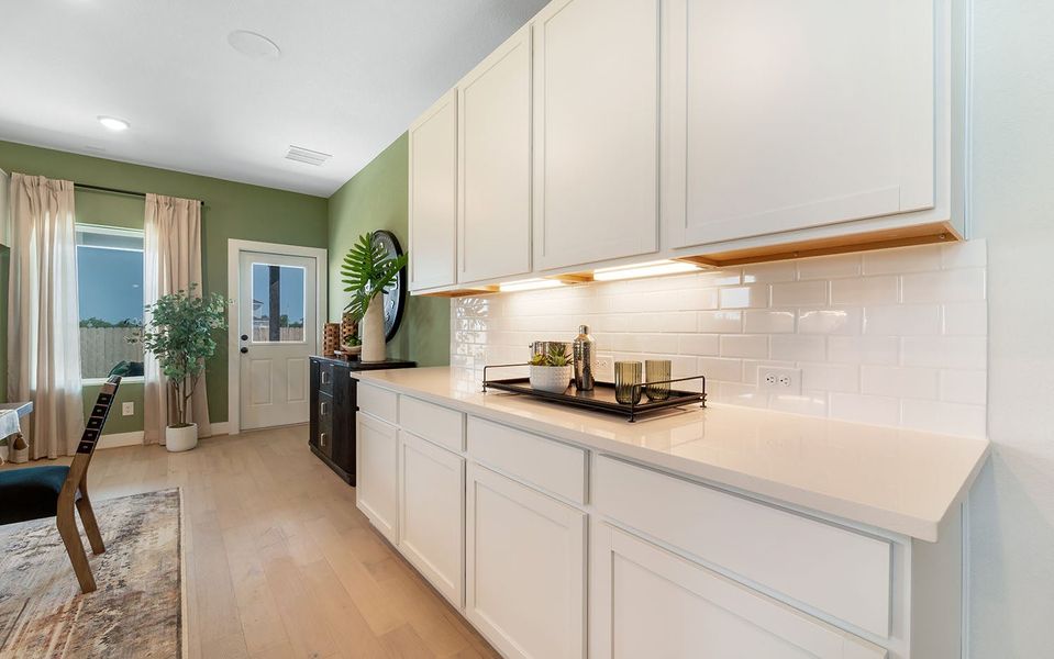 Furnished interior in a model home at Grande Estates in Bertram (Image 21).