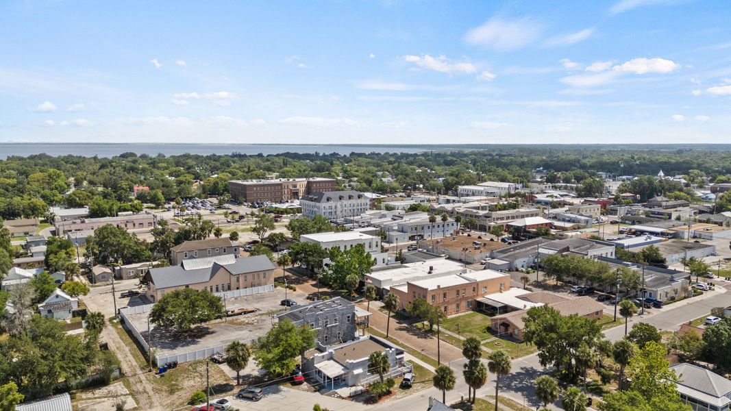 Aerial view of downtown St. Cloud FL showcasing historic buildings, Lake Tohopekaliga in the distance near Cyrene at Harmony. Aerial view of downtown St. Cloud FL showcasing historic buildings, Lake Tohopekaliga in the distance near Cyrene at Harmony.