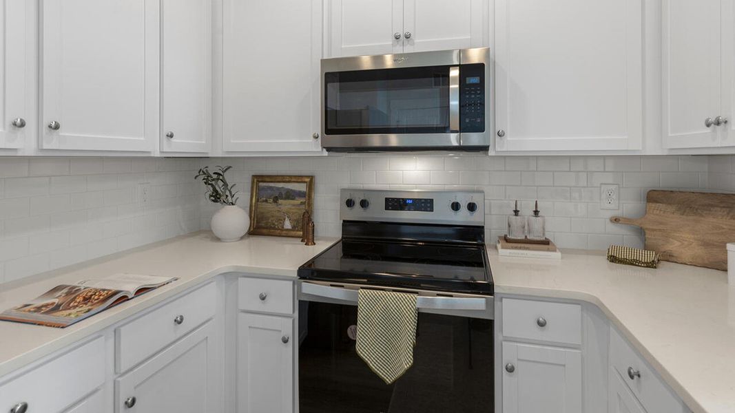 Furnished interior in a model home at The Palms at Indigo Preserve Townhomes in Leland (Image 16).