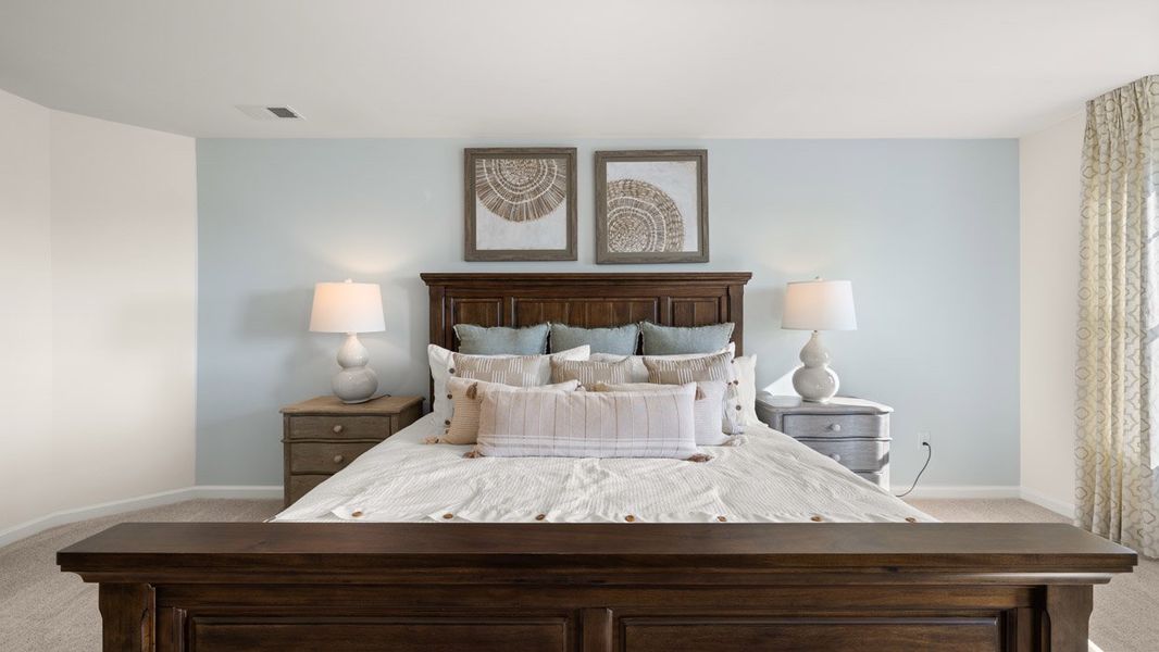 Furnished interior in a model home at Preserve at Dove Creek in Statham (Image 17).