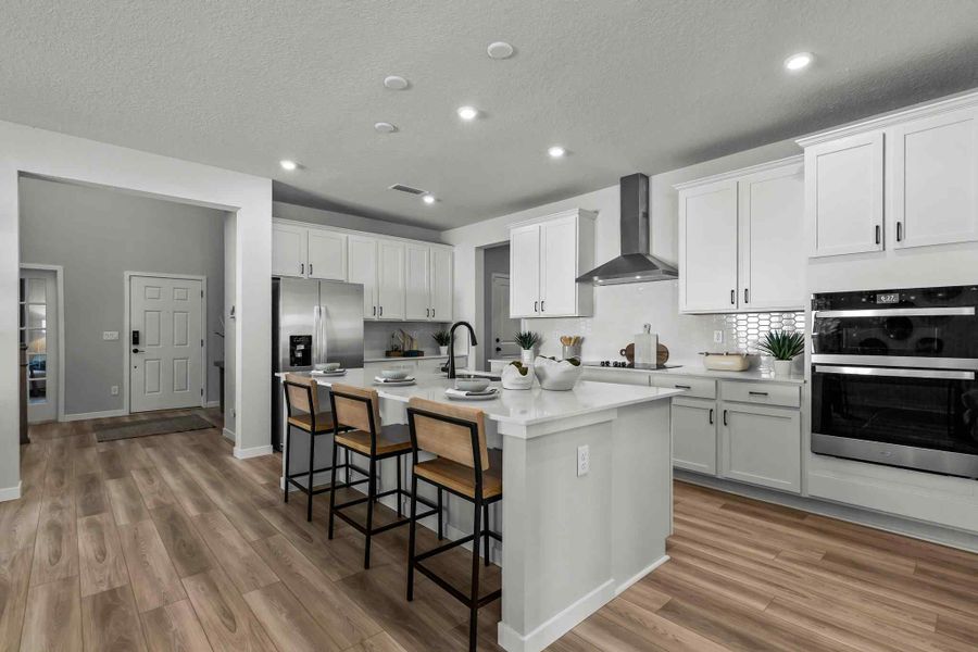 A kitchen with white cabinets. A kitchen with white cabinets.