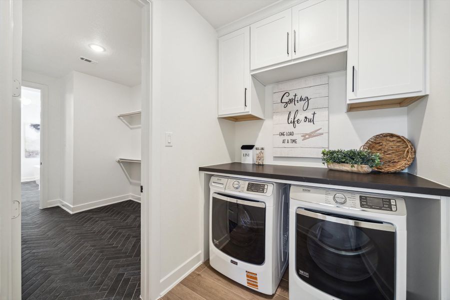 Furnished interior in a model home at ARTAVIA® - 40' in Conroe (Image 36).