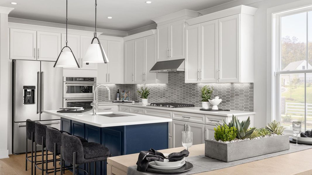 Gourmet kitchen boasts a large center island and stainless steel appliances