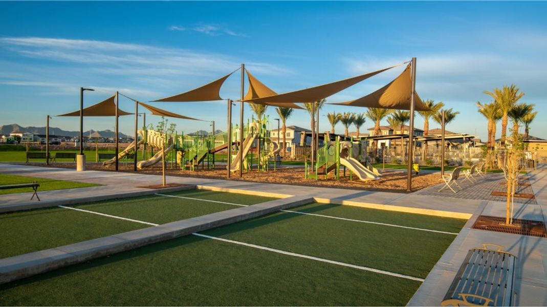 Bocce ball courts with the playground in the distance