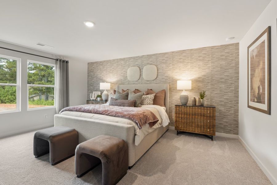 A bedroom with a bed and a couch. A bedroom with a bed and a couch.