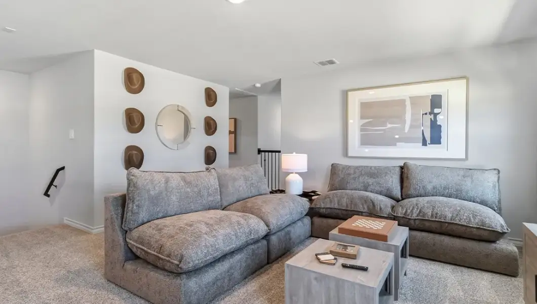 Furnished interior in a model home at The Woodlands at Medina Hills in Mico (Image 34).